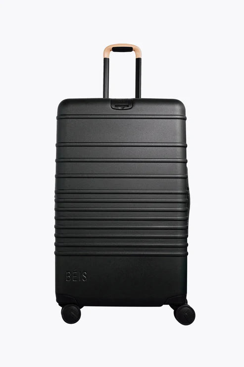 Travel bag with a retractable garment rack for easy unpackingThe Large Check-In Roller in Black