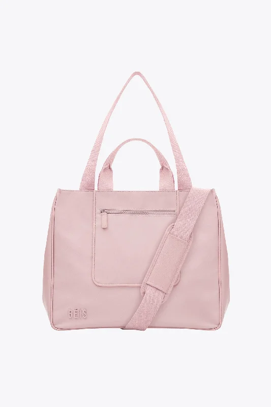 Travel bag with a built - in power bank charger for on - the - go device chargingThe East To West Tote in Atlas Pink