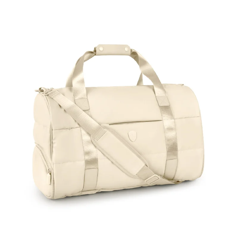 Smart travel bag with integrated GPS tracker for lost item recoveryThe Puffer Duffel Bag - Ivory