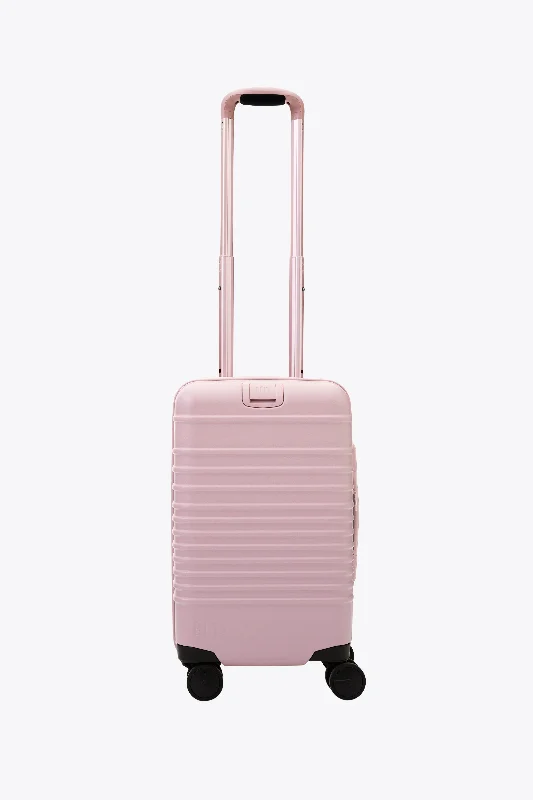 Travel bag with a retractable garment rack for easy unpackingThe Small Carry-On Roller in Atlas Pink