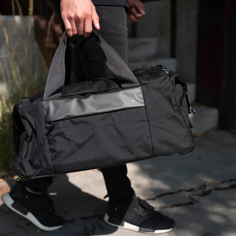 Leather duffel bags with antique brass hardware for a classic and luxurious lookErrant Duffel Bag - Obsidian Black